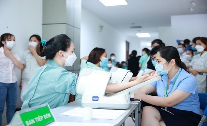 Khám sức khỏe sinh sản cho công nhân KCN Bắc Thăng Long (Hà Nội). Ảnh: hải nguyễn Cung cấp dịch vụ chăm sóc sức khỏe sinh sản cho công nhân